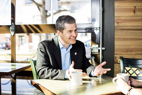 Mike gives back to his alma mater by mentoring students and helping them prepare for careers in business.