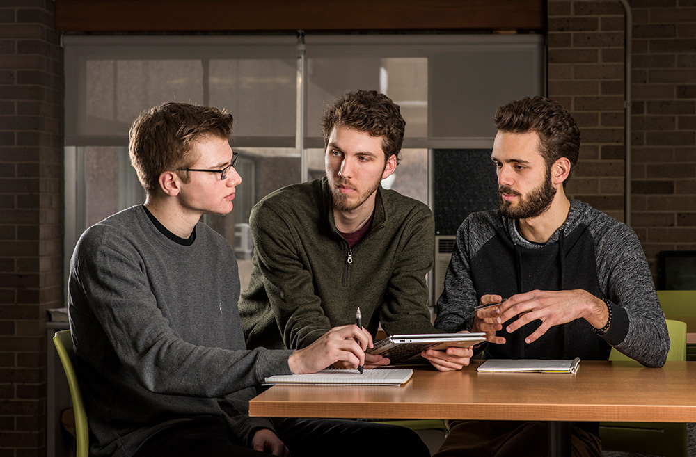 Derek Wautlet (left), Nick Peterson, and Ben Hermann