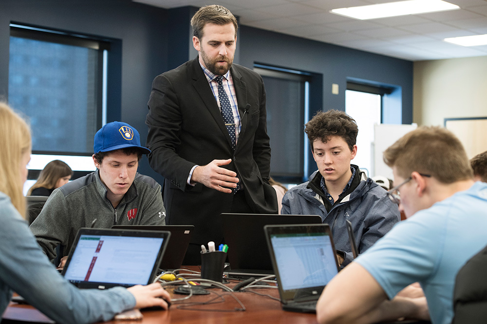 Professor Paul Hoban looks over his business analytics class
