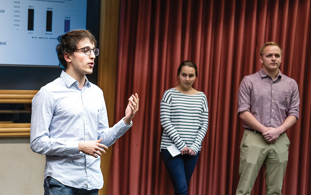 A UW School of Business MBA student makes a point during a presentation