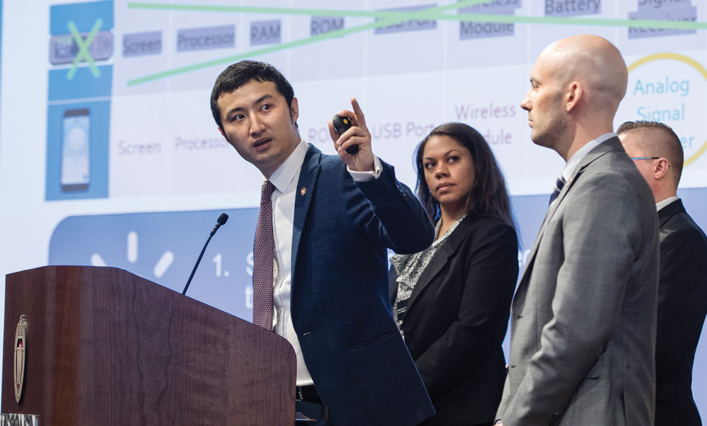 A UW School of Business MBA student makes a point during a presentation