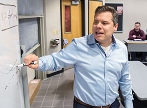 UW School of Business analytics instructor Dani Bauer teaches a class