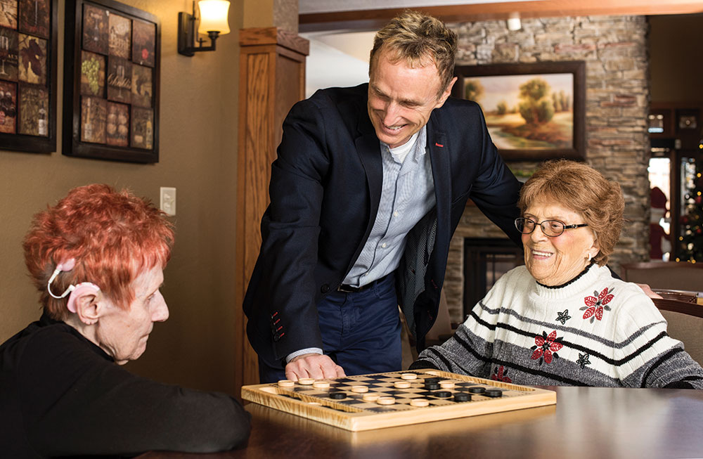 Milo Pinkerton gets to know residents at the Heritage Senior Living property in West Allis, Wisconsin