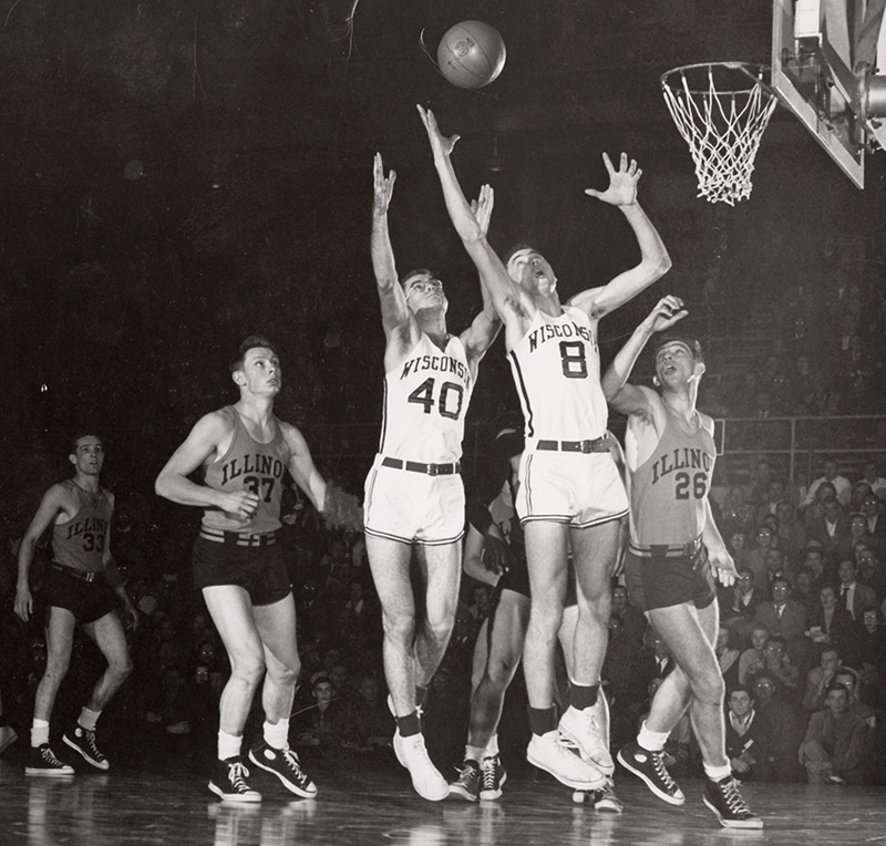 Wisconsin basketball star Ab Nicholas, player number eight, catches a rebound
during a game against Illinois in the early 1950s.