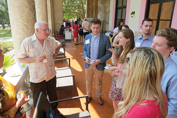 José Luis Rodríguez García (L), Cuba’s former minister of economy and planning
and one of the creators of the country’s dual currency system, explains the difference between Cuban pesos and convertible pesos to UW–Madison students.