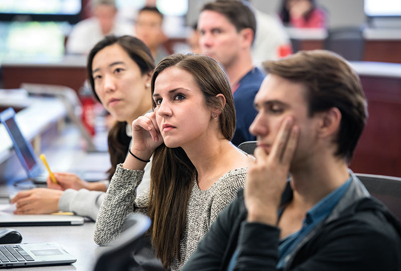 Emma Ebert (MBA ’19) listens during her class on blockchain and cryptocurrency.
