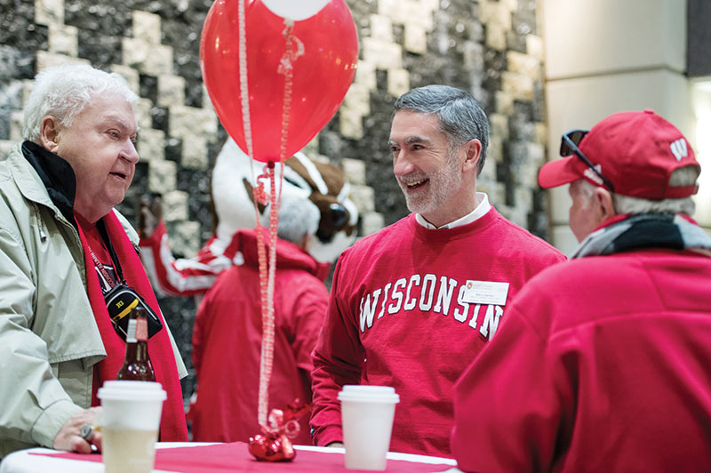 Interim Wisconsin School of Business Dean Barry Gerhart mingles with guests at the Homecoming Bash