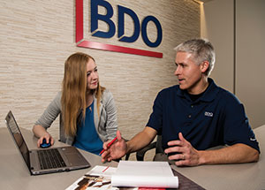  Megan Allen (BBA ’18, MAcc ’19) and Derek Matzke (BBA ’01, MAcc ’02) talk taxes as the season kicks into full gear at BDO’s Madison office, giving Allen valuable experience during her internship.