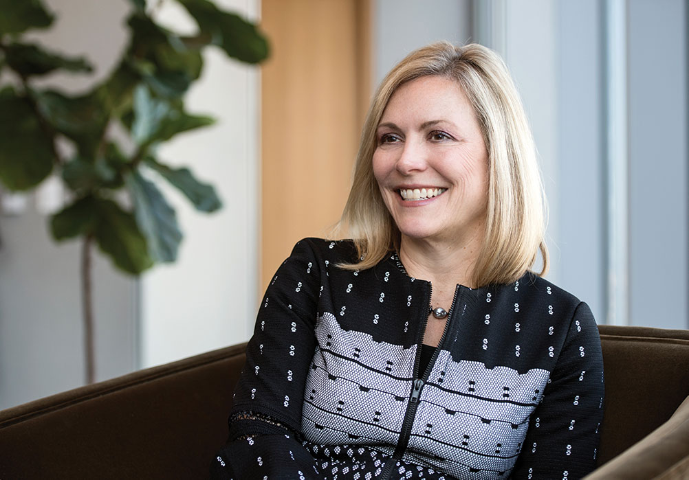 Julie Howard leads a meeting in a conference room of Navigant's downtown Chicago headquarters