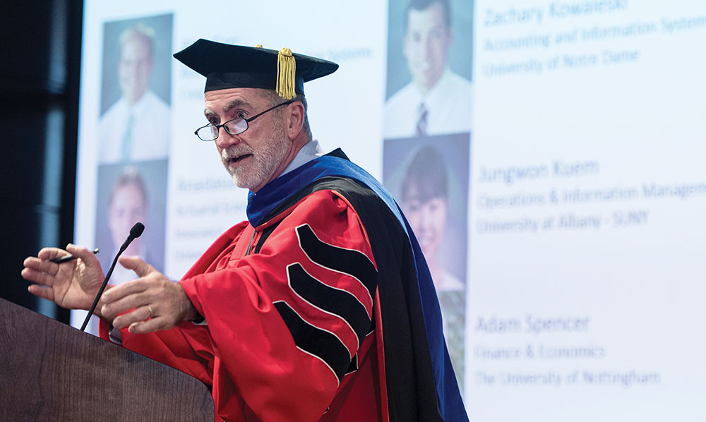 Outgoing interim WSB Dean Barry Gerhart addresses a graduation ceremony