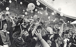 UW-Madison graduates release balloons and throw confetti at Camp Randall in 1978