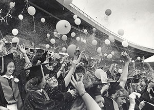 UW-Madison graduates release balloons and throw confetti at Camp Randall in 1978