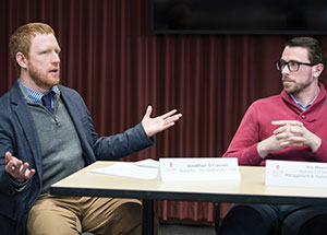 Washington Post reporter Jonathan O’Connell moderates a faculty panel discussion featuring Jirs Meuris, assistant professor of management and human resources at UW-Madison.